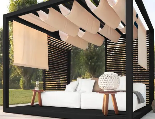 Stylish outdoor lounging space with curtains.