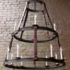 Rustic chandelier with candle lights hanging.