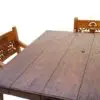 A wooden table and two benches on top of it.