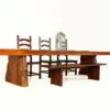Wooden table with chairs and lantern.