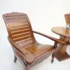 A wooden chair and table set up for outdoor dining.