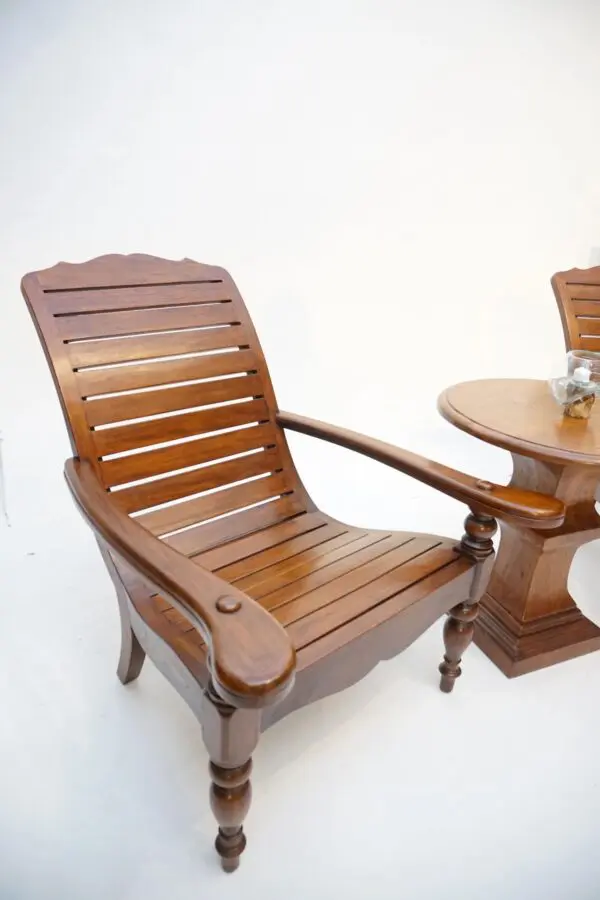 A wooden chair and table set up for outdoor dining.