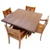 Wooden dining table with four chairs.