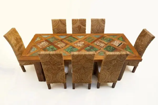 Dining table with patterned wood and chairs.