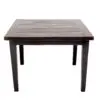 A table with two legs and one of the legs is missing.