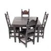 A table and chairs set up for dinner.