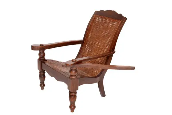 A wooden chair with an arm rest on it.