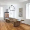 A large wooden table in the middle of a room.