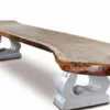 Wooden table with unique stone legs.