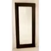 A mirror with a wooden frame on the wall.