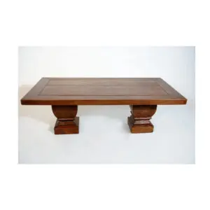 A wooden table with two pillars on top of it.