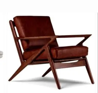 A brown chair with wooden arms and legs.