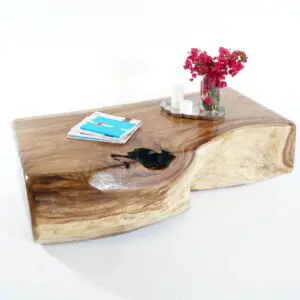 A wooden object with a key and flower vase.