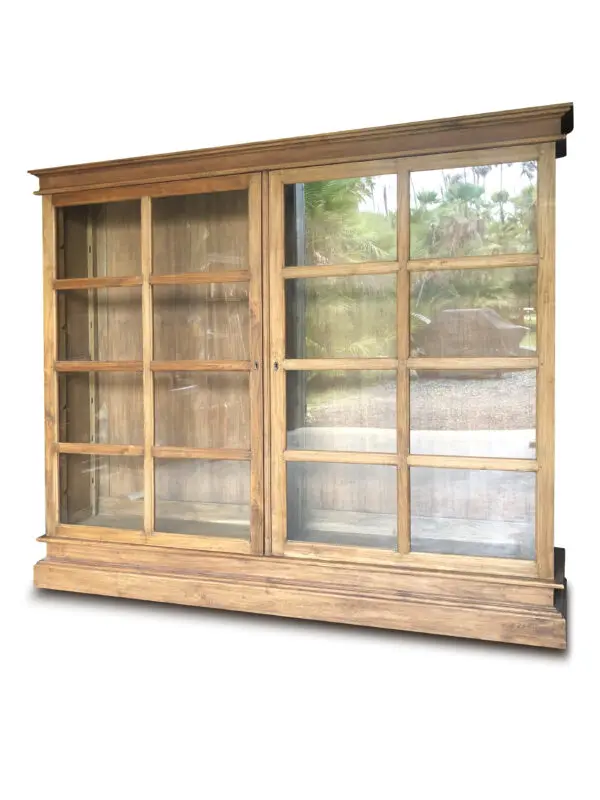 Wooden display cabinet with glass doors.