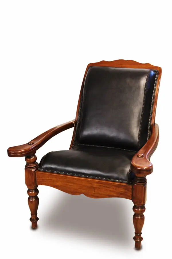 Classic wooden chair with black leather upholstery.