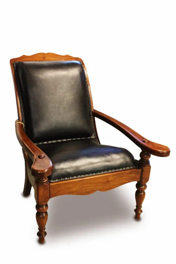 Classic wooden chair with black leather upholstery.