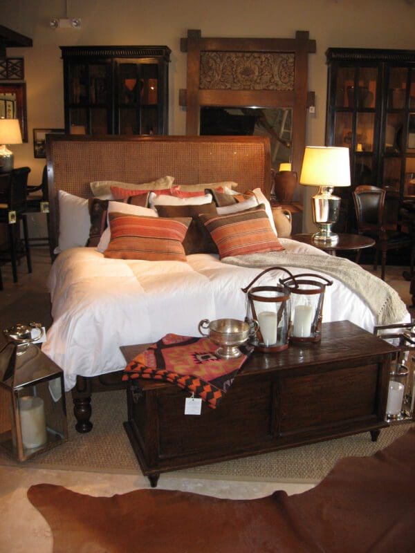 Bedroom with a wooden bed and chest.