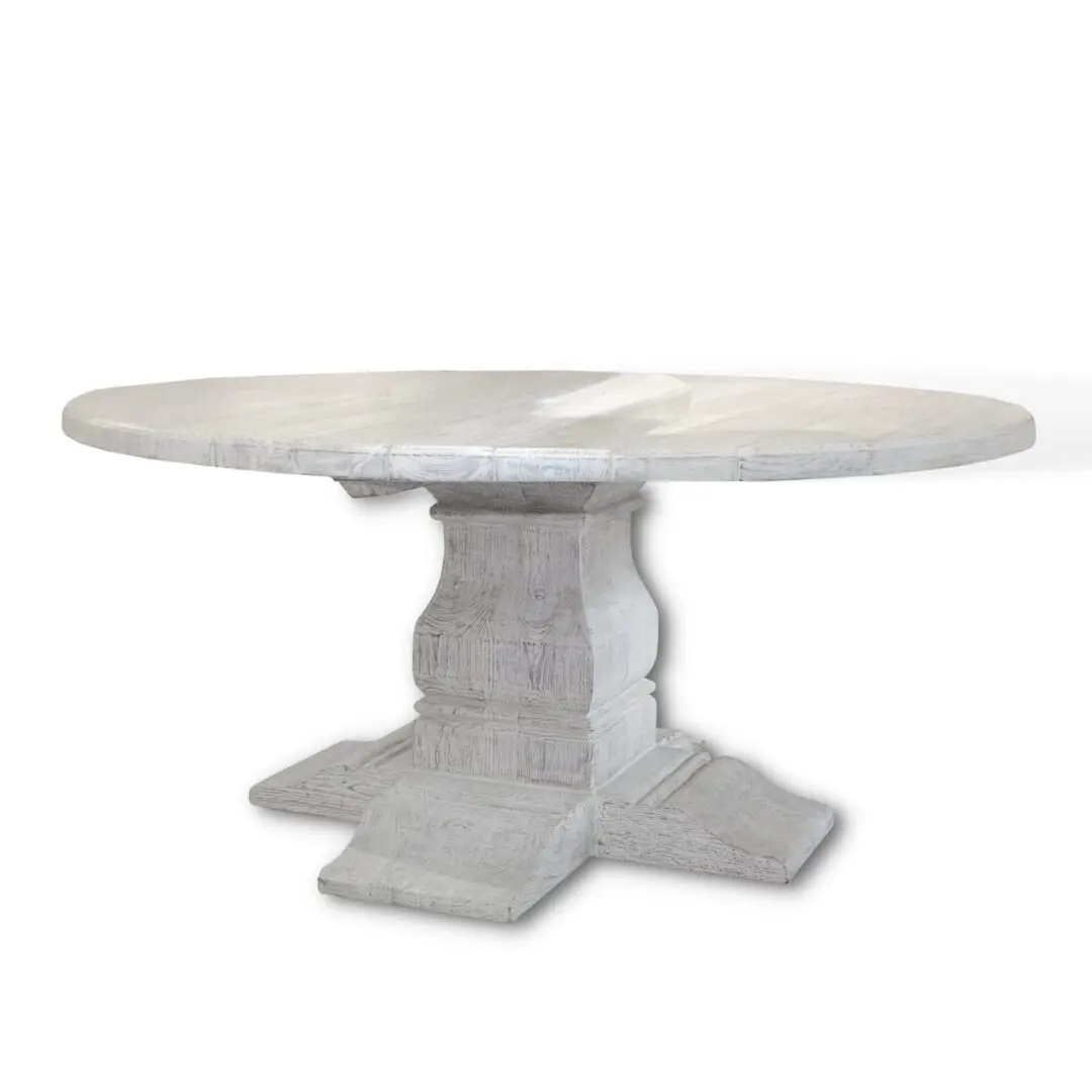 A white table with a large base on top of it.