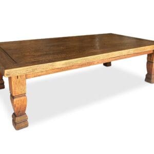 A wooden table with a brown top and two legs.