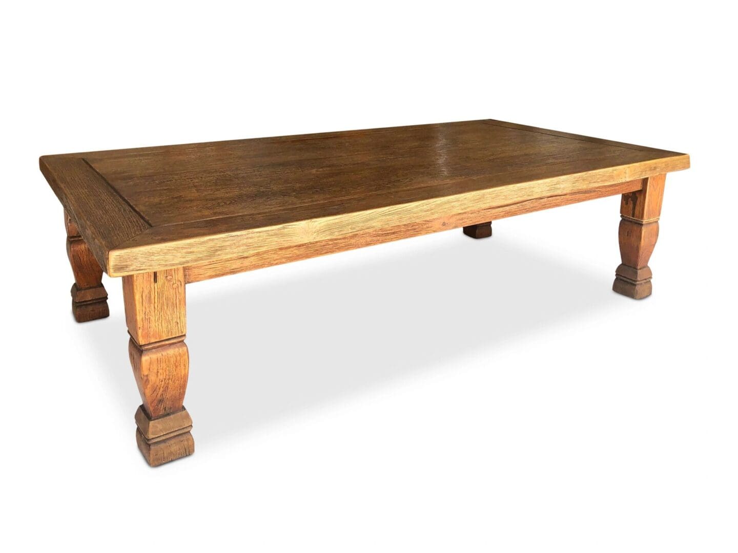 A wooden table with a brown top and two legs.