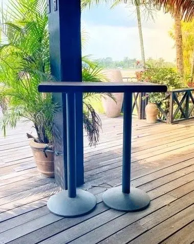 A table with two legs on the ground