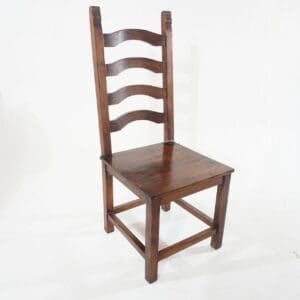A wooden chair with a brown seat and back.