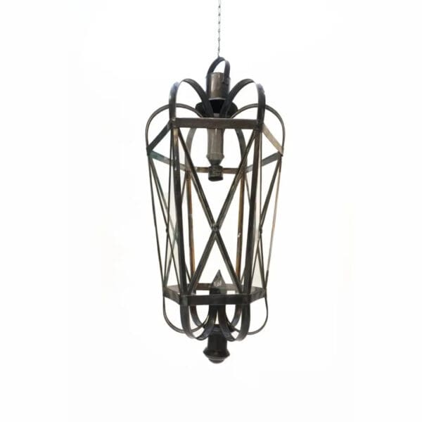 A black metal hanging light fixture with a white background
