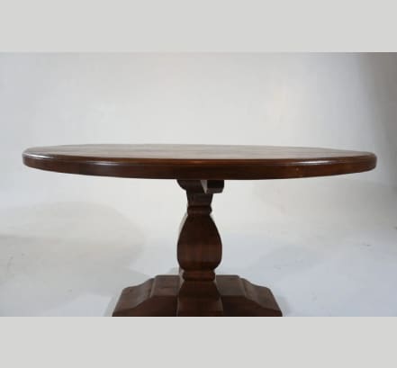 A round table with a pedestal base.
