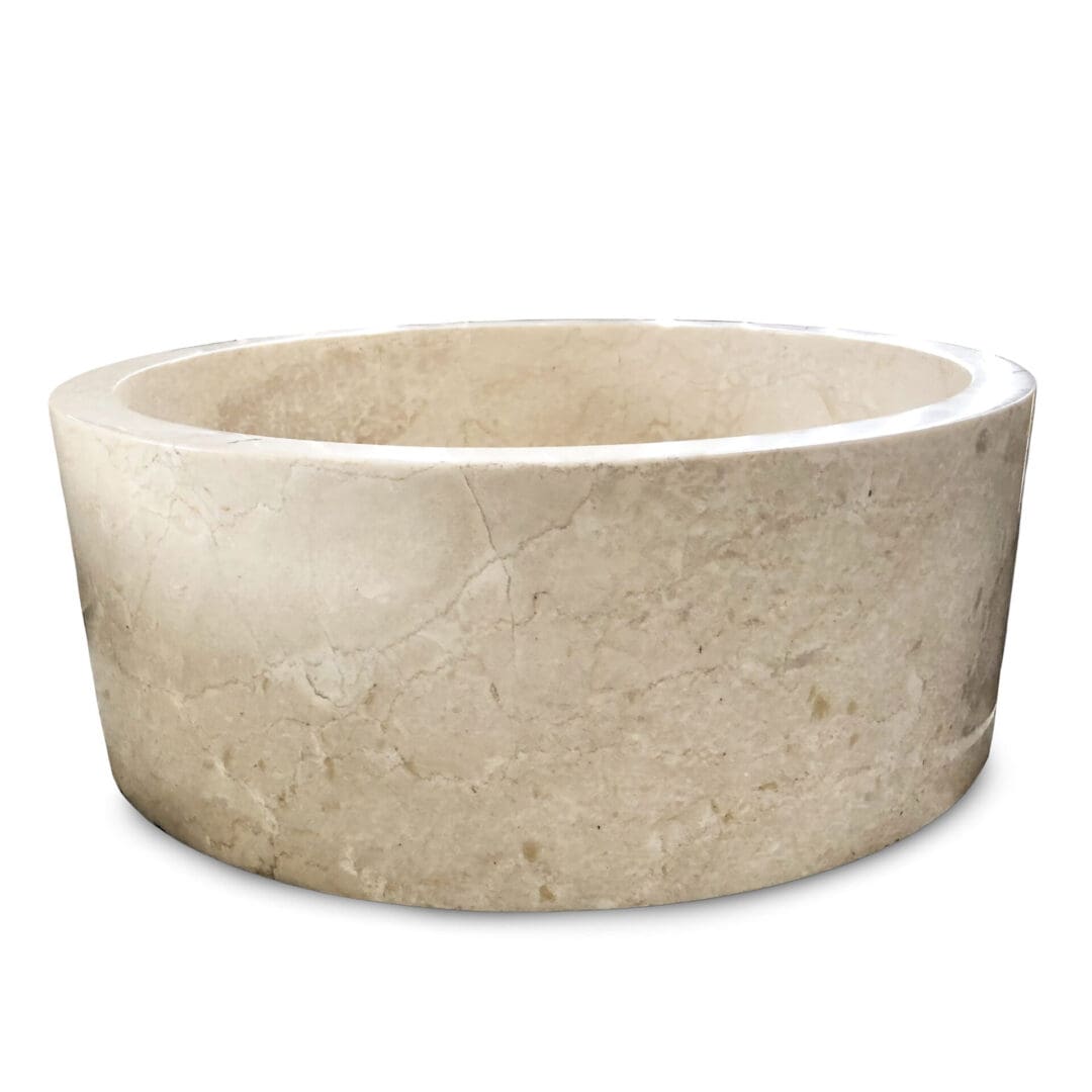 A large stone bowl sitting on top of a floor.