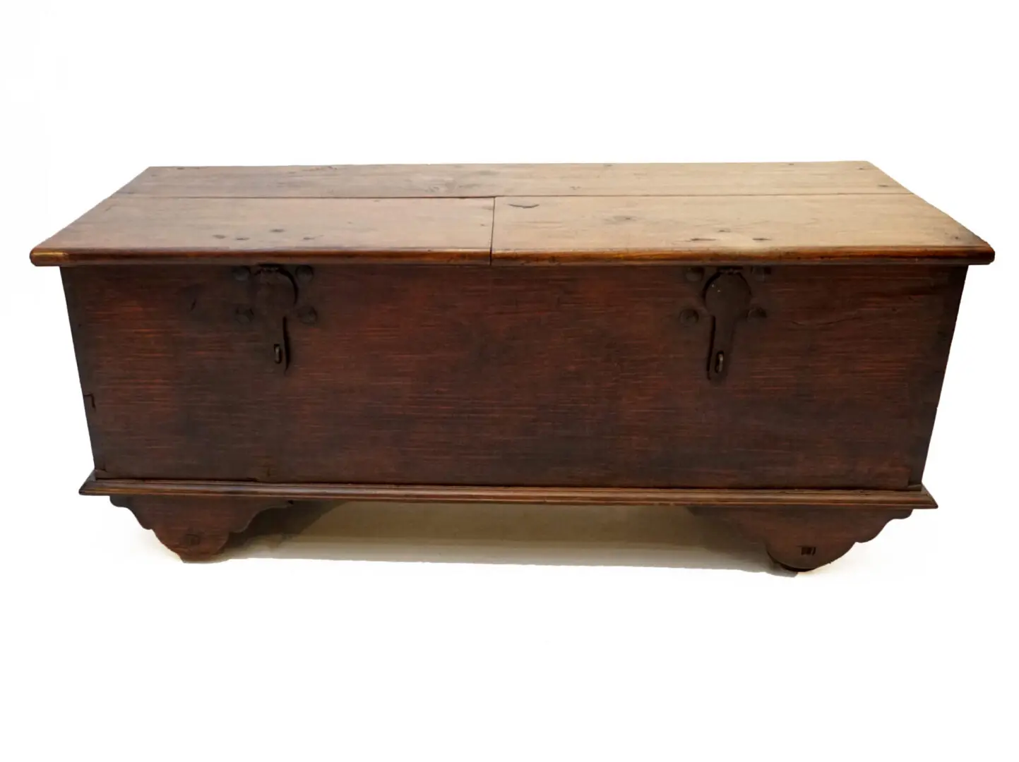 A wooden trunk with metal handles and two drawers.