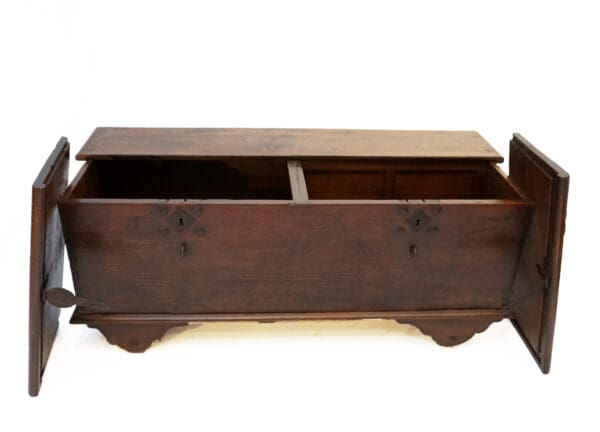 A wooden box with two compartments on top of it.