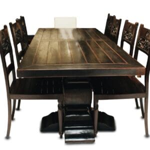 A table and chairs set up to look like an old fashion dining room.