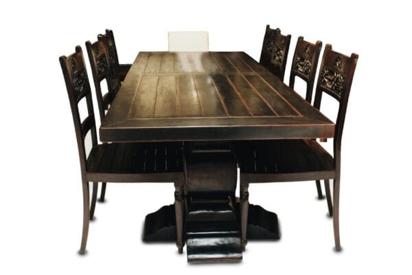 A table and chairs set up to look like an old fashion dining room.