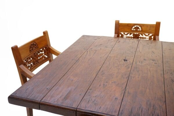 A wooden table and two benches on top of it.