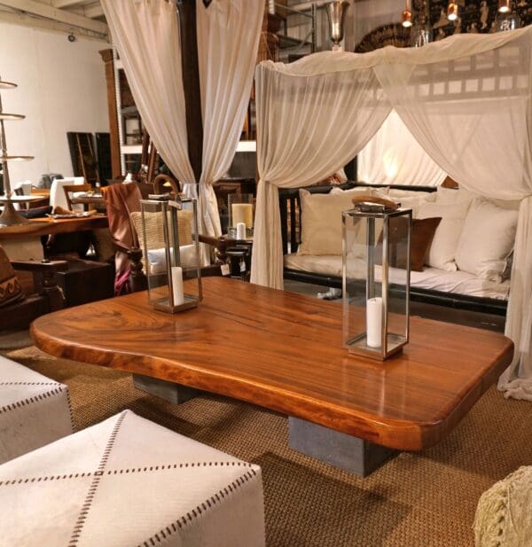 A large wooden table with candles on top of it.