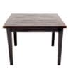 A table with two legs and one of the legs is missing.