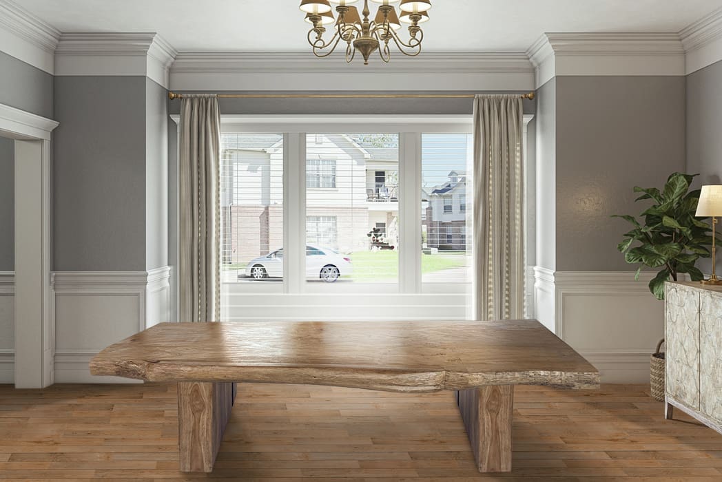 A large wooden table in front of a window.