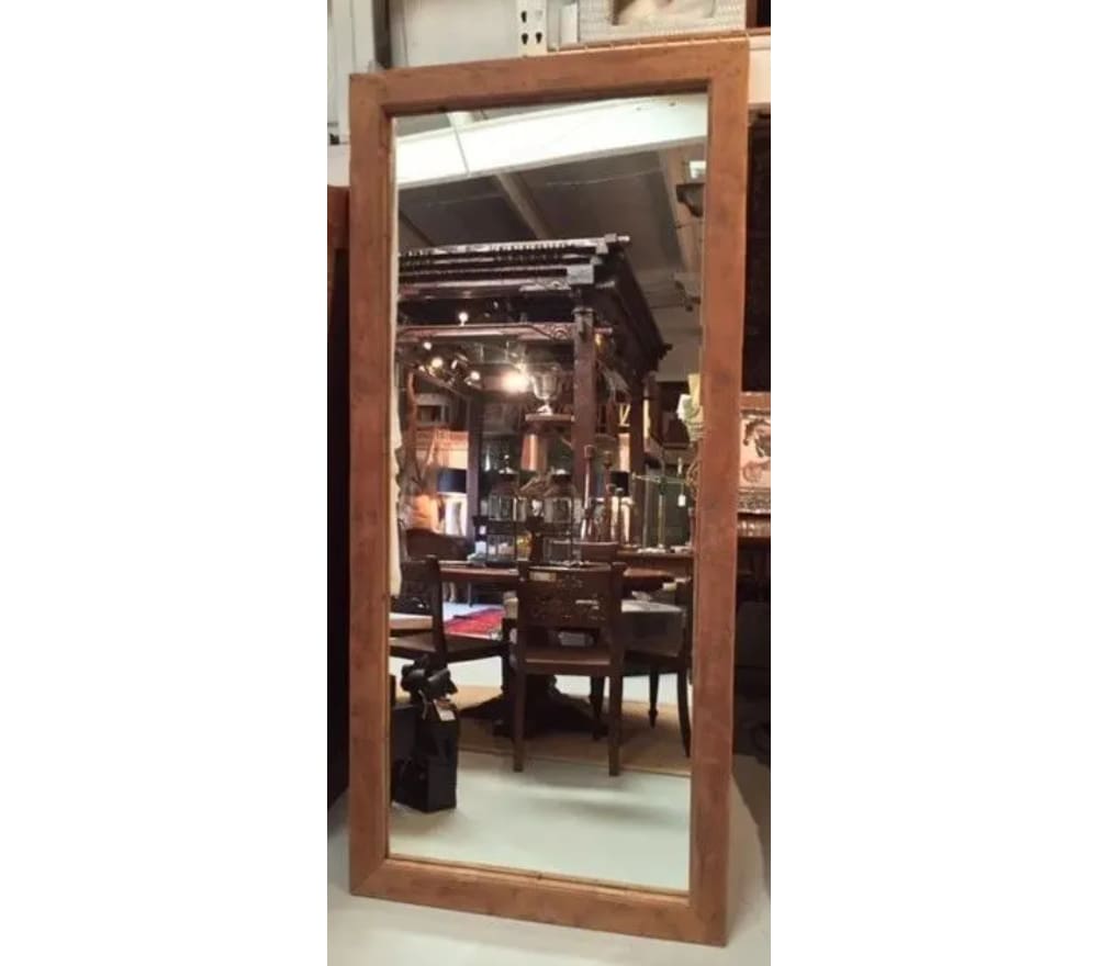 A large mirror in the middle of a room.
