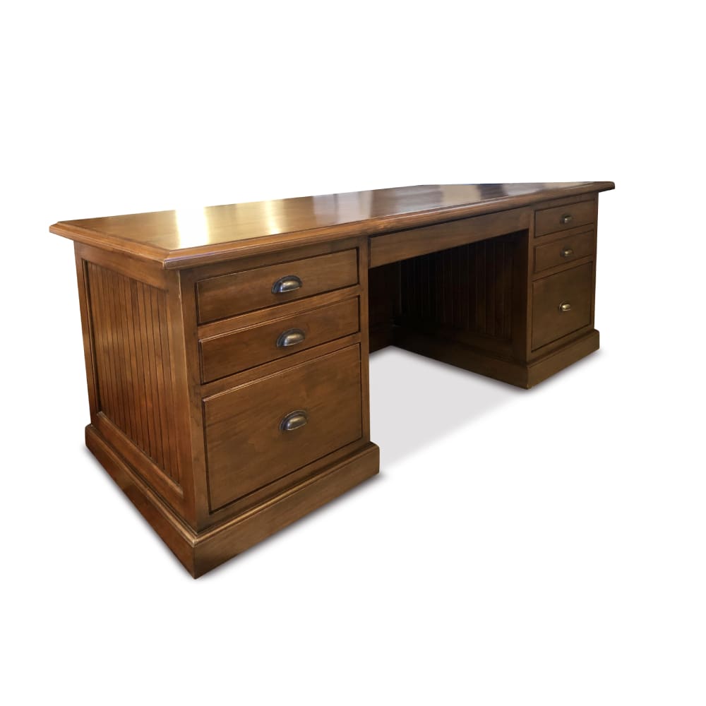 A wooden desk with three drawers and one large open compartment.