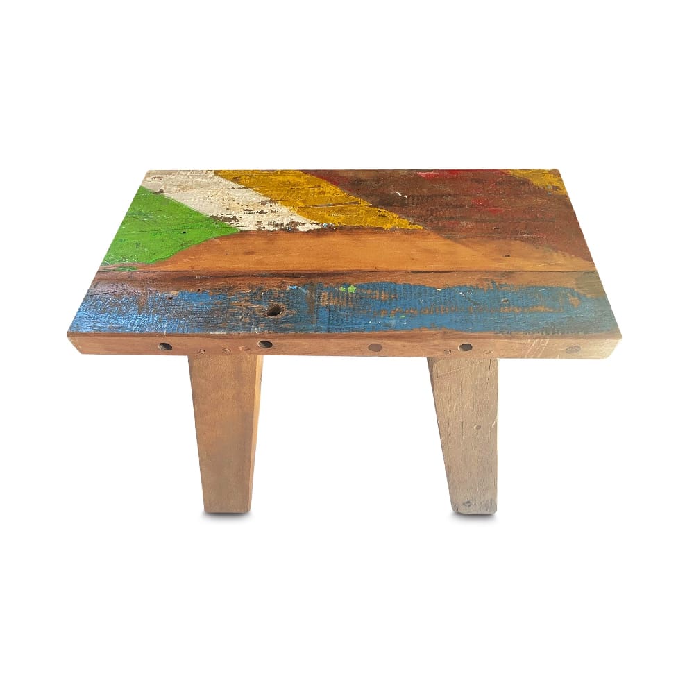 A table with colorful wood and metal on top.