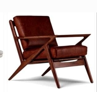 A brown chair with wooden arms and legs.