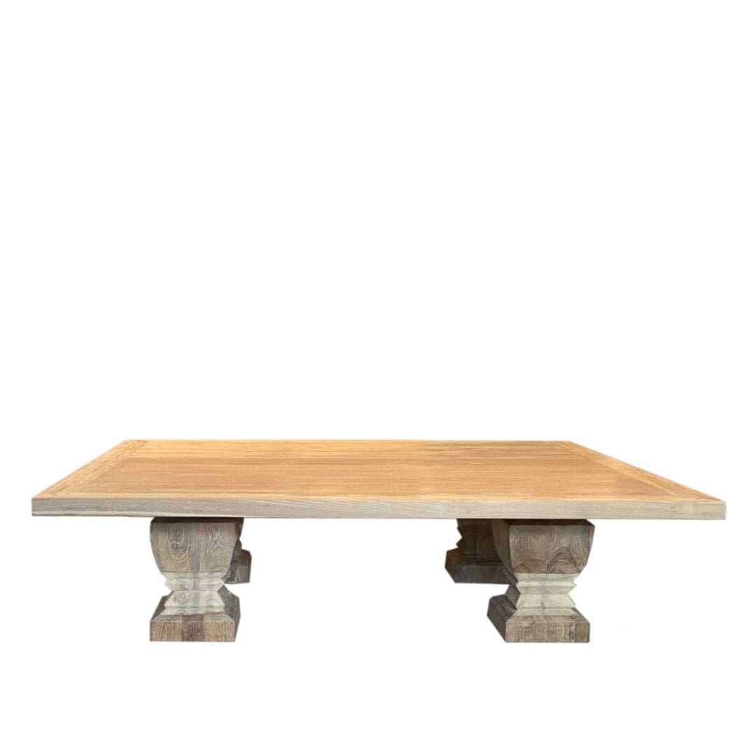 A square table with two stone legs on top.
