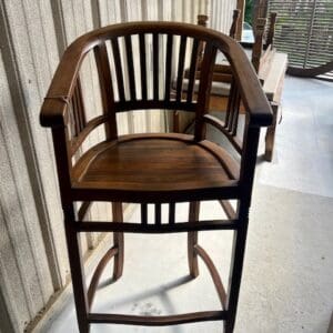 Wooden chair with slatted back and seat.