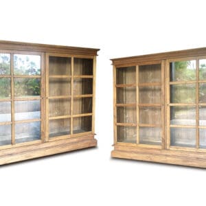 Two wooden display cabinets with glass doors.